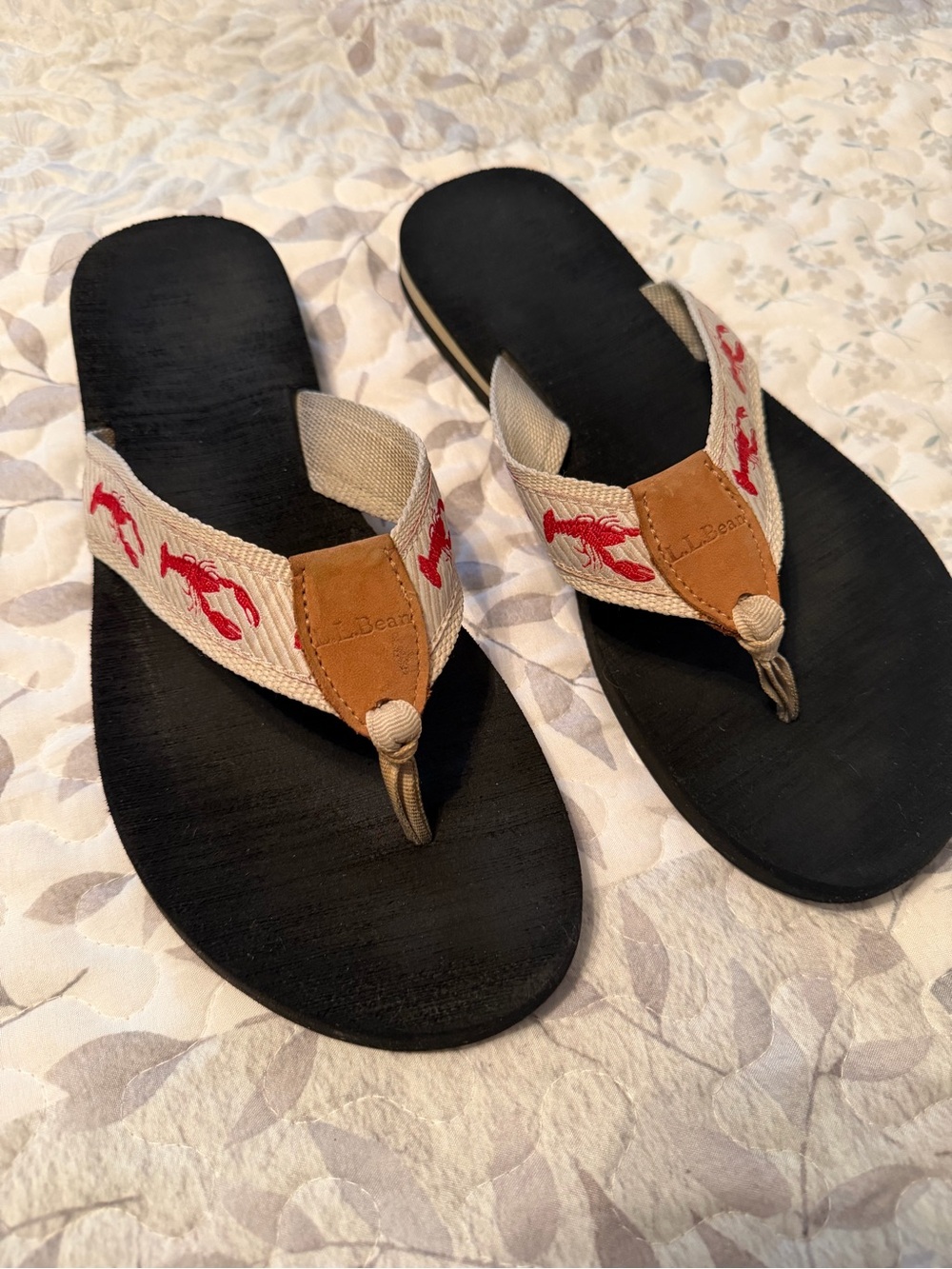 L.L. Flip Flops with Tan Straps and Red Lobster design.